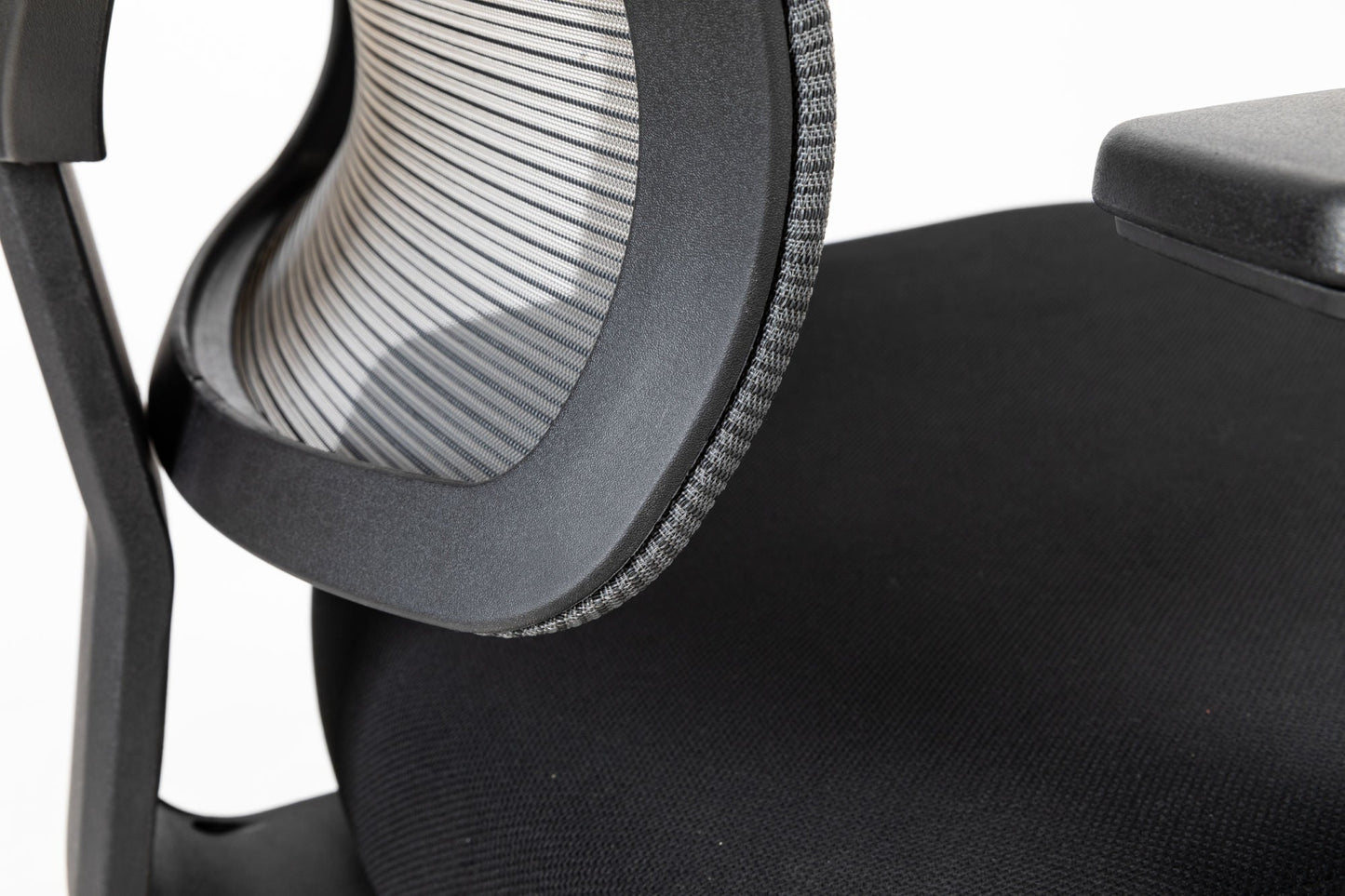 Black office chair close-up of mesh back and dark padded seat