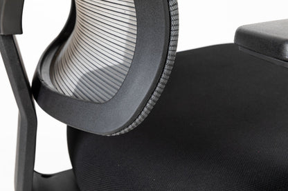 Black office chair close-up of mesh back and dark padded seat