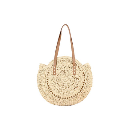 Handmade straw tote bag with round crochet pattern and tan leather-look handles