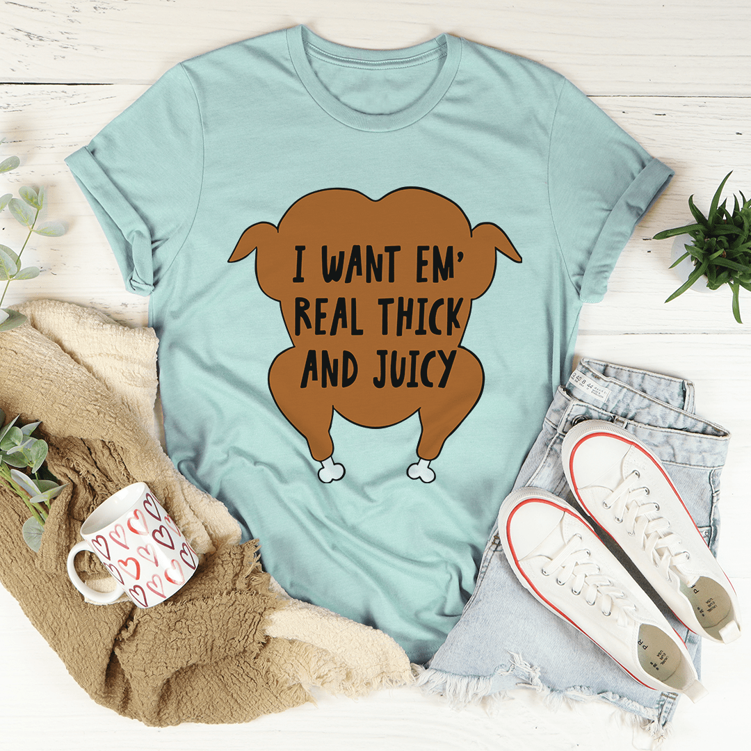 Heather blue crew-neck T-shirt with brown cartoon and 'REAL THICK AND JUICY' print