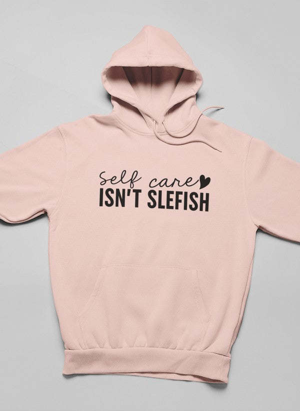 Light peach hoodie with hood and kangaroo pocket, 'Self care isn't selfish' front print