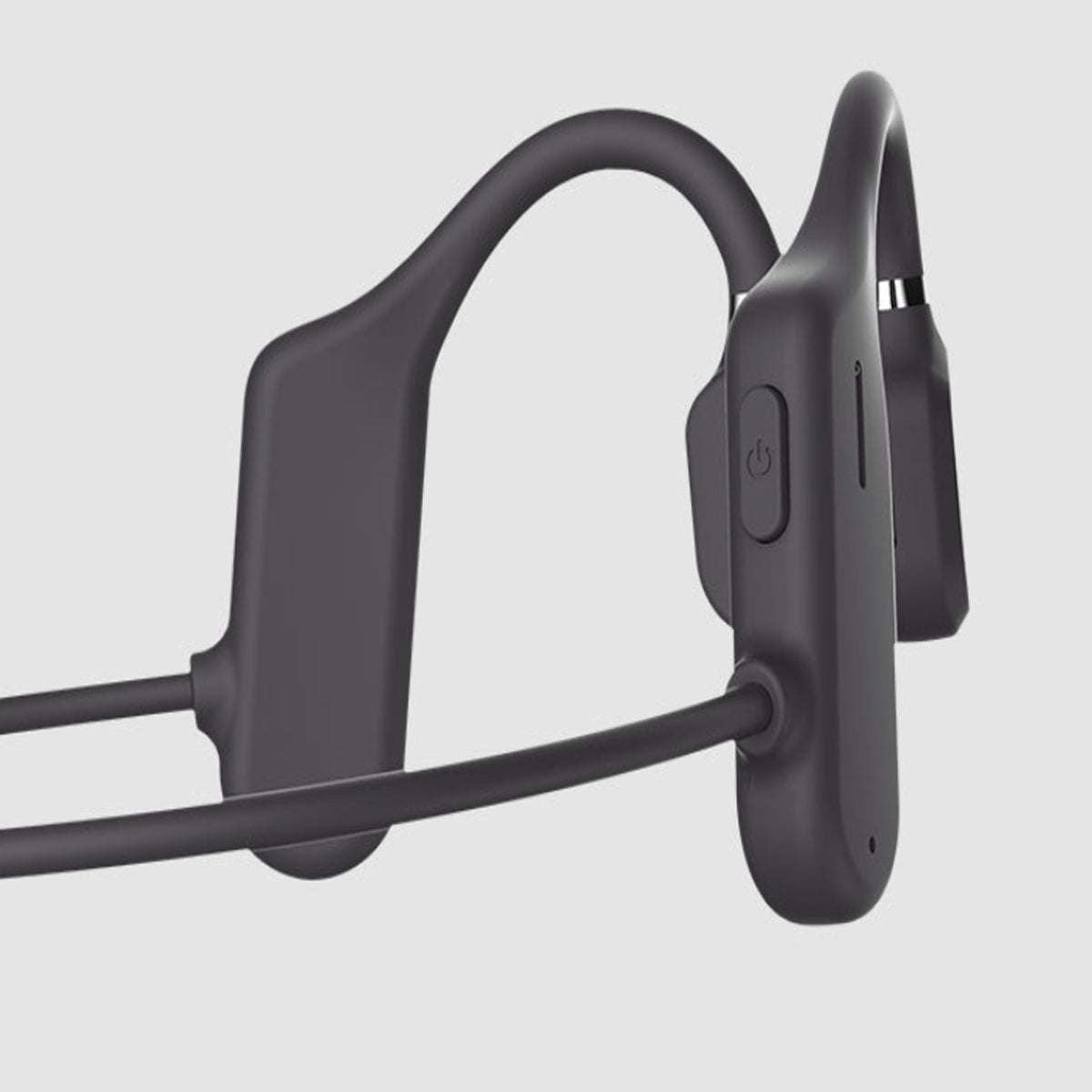 Dark gray open-ear wireless headphones, close-up of earhook and ear-tips