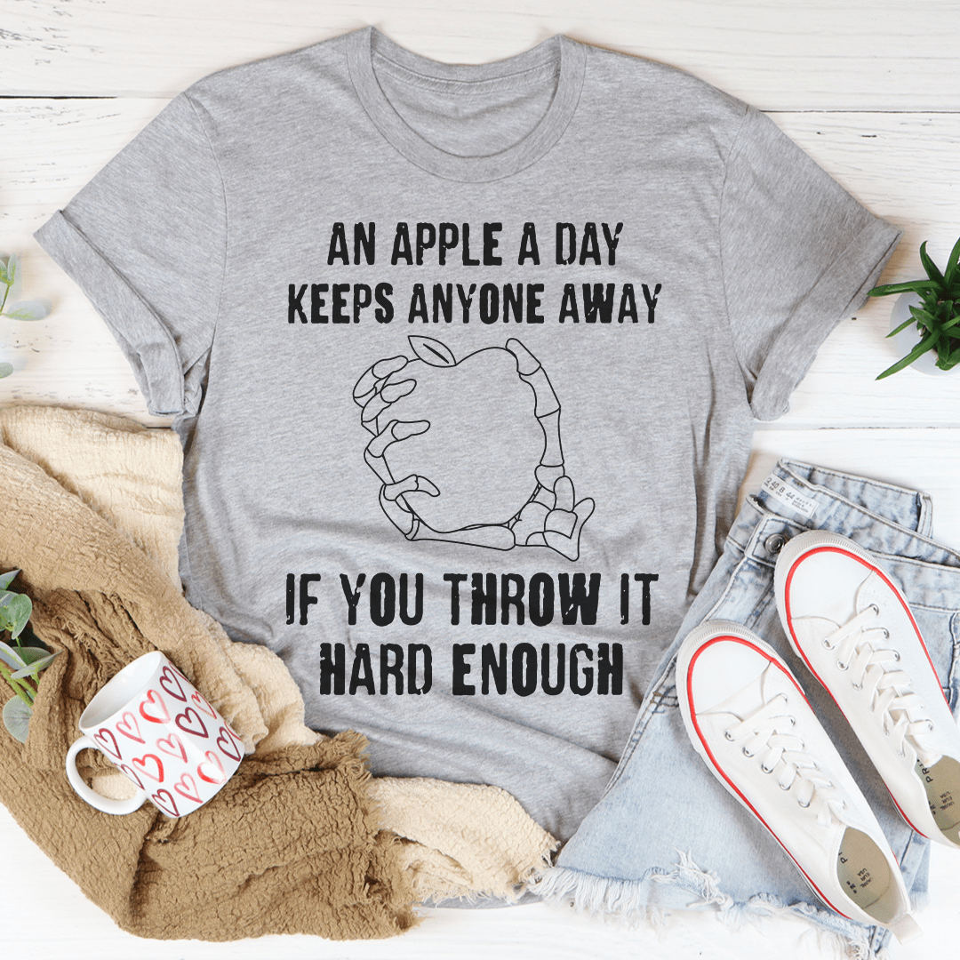 Gray crew-neck T-shirt with apple graphic and slogan "Throw it hard enough"
