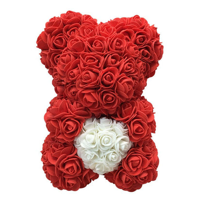 Rose teddy bear in red roses with white rose heart and black bow ribbon