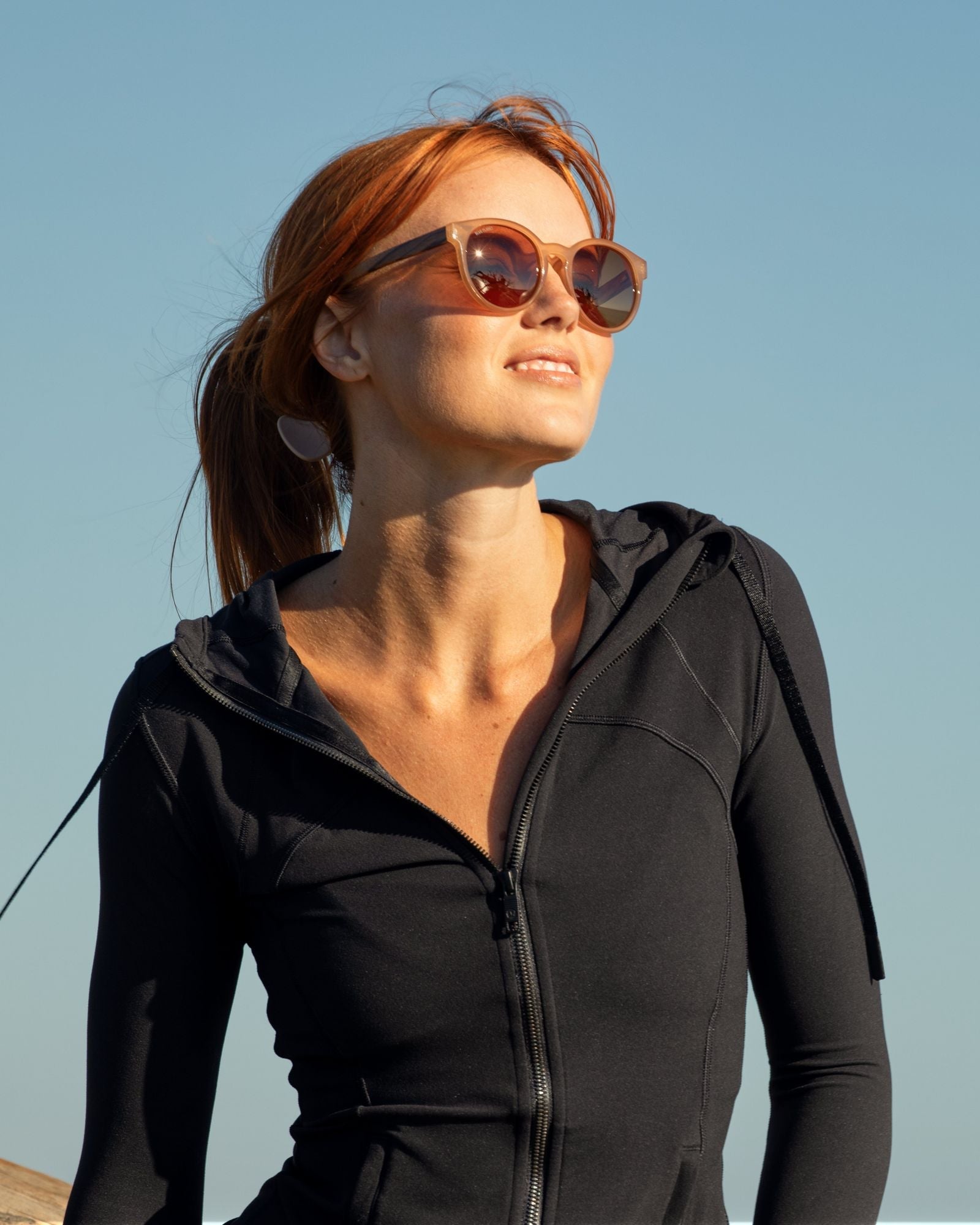 REAGAN polarized sunglasses on model, brown frames and dark polarized lenses