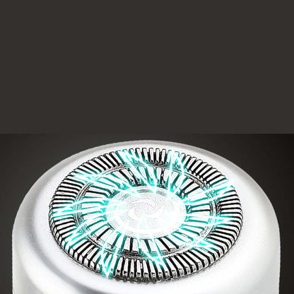 Round shaving head of a silver mini USB shaver with protective foil
