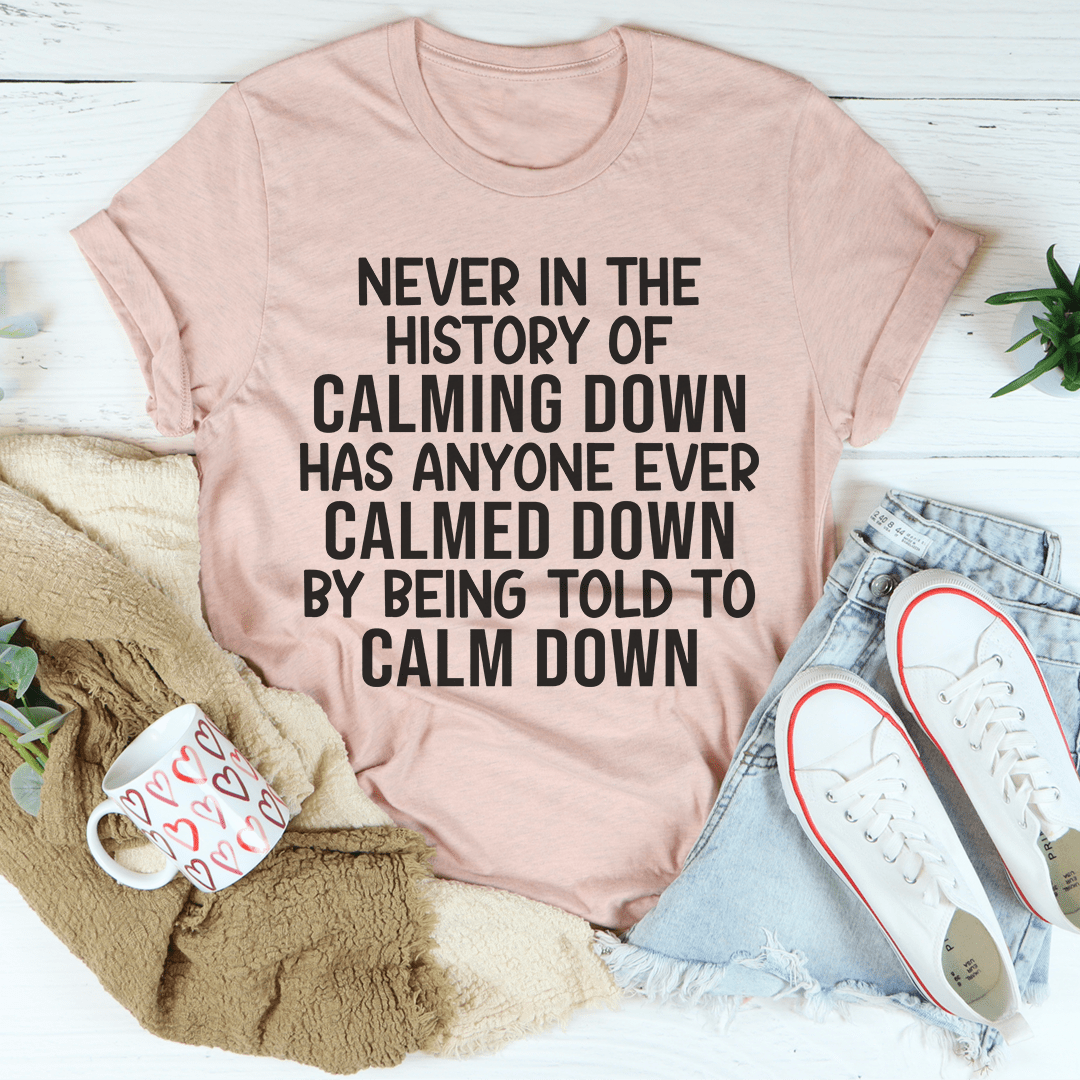 Mauve crewneck T-shirt with bold stacked quote graphic: "Calming down"