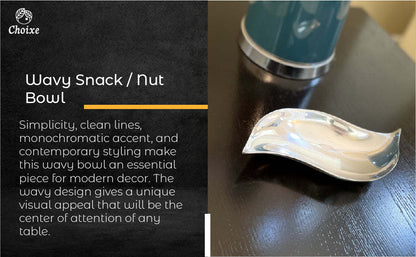 Wavy snack nut bowl, reflective silver aluminum dish on countertop
