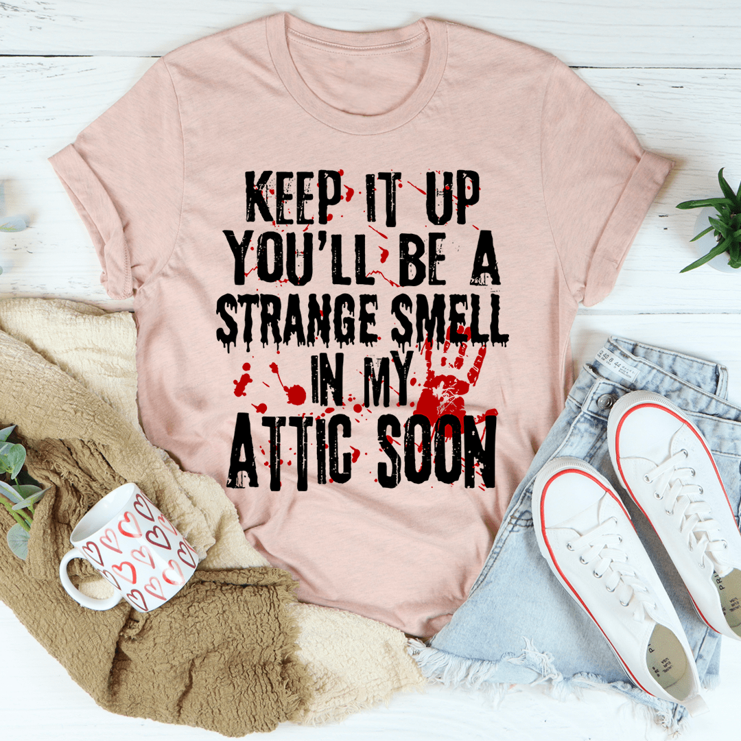 Dusty pink crew-neck T-shirt with bold graphic text and red ink splatter