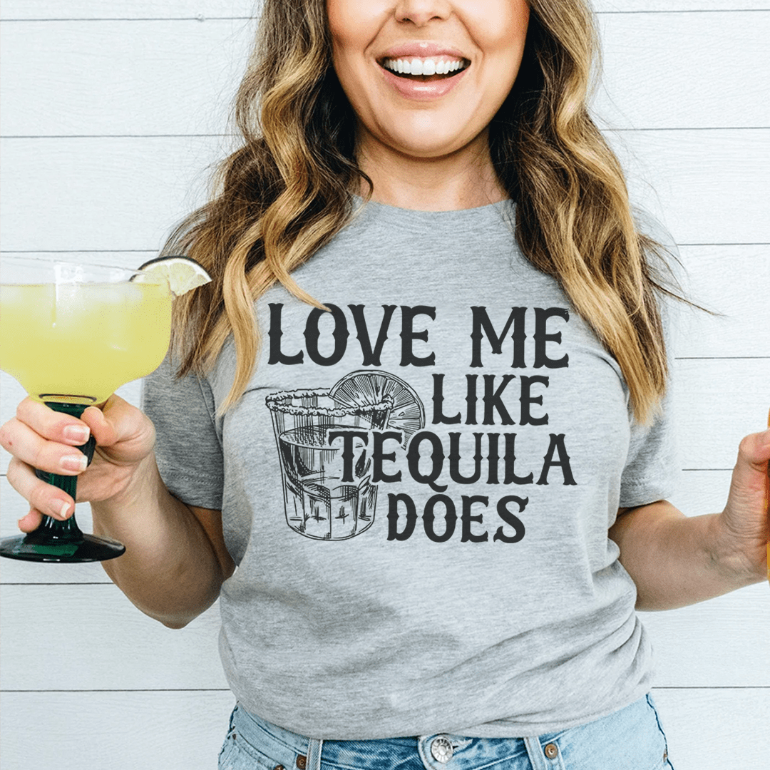 Heather gray crew-neck T-shirt with 'LOVE ME LIKE TEQUILA DOES' graphic, worn by model