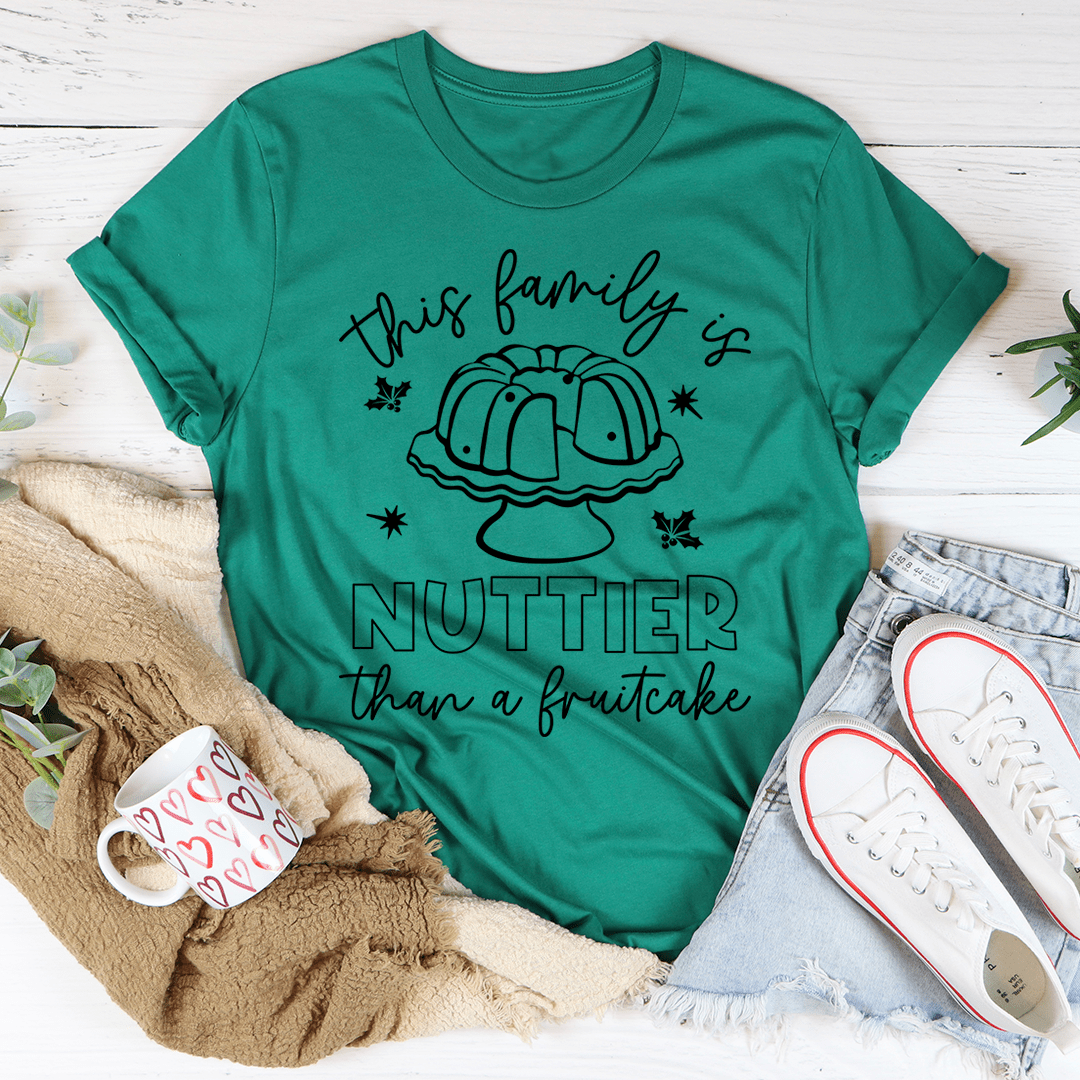 Green T-shirt with 'NUTTIER than a fruitcake' graphic