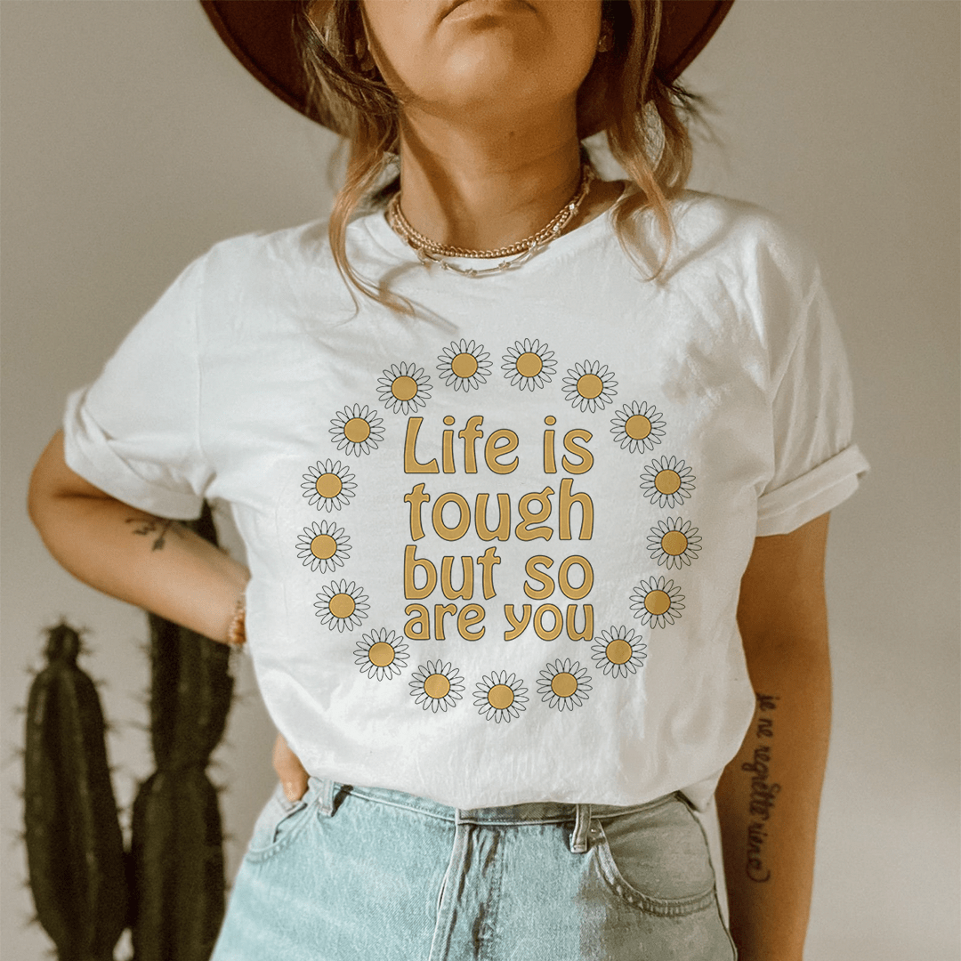 White short-sleeve crewneck tee with daisy wreath slogan graphic centered