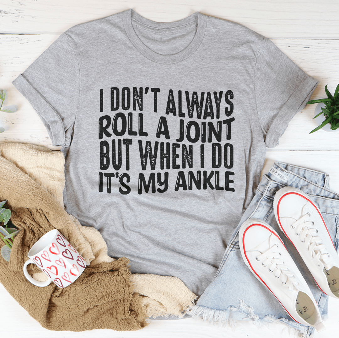 Heather gray graphic crewneck t-shirt with 'ROLL A JOINT' slogan print.