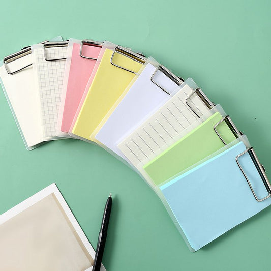 Mini clipboard notepad set with multiple colored sheets, each with a silver clip