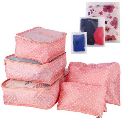 Pink polka dot packing cube set with zippered compartments and matching accessory pouches
