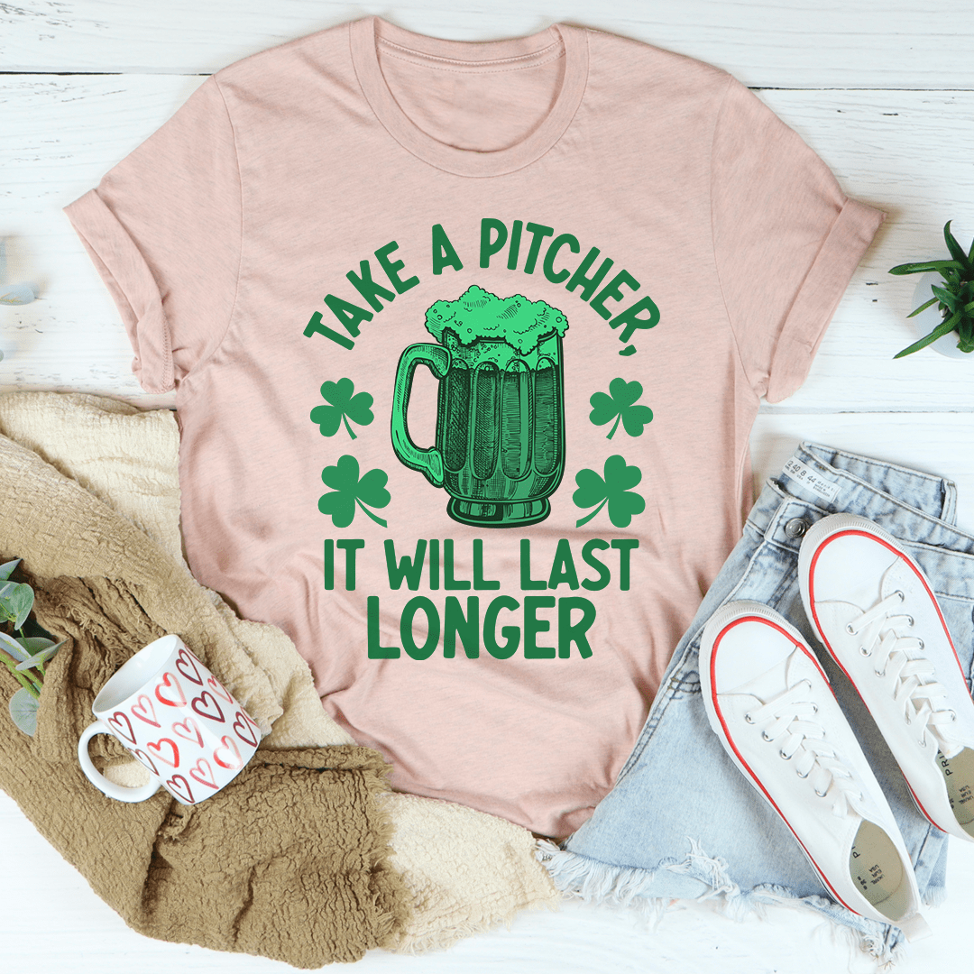 Pink heather T-shirt with green beer-mug graphic and “TAKE A PITCHER IT WILL LAST LONGER”
