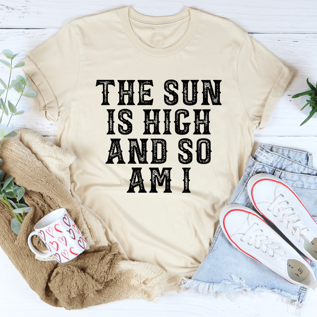 Heather dust graphic T-shirt with black slogan text: THE SUN IS HIGH AND SO AM I