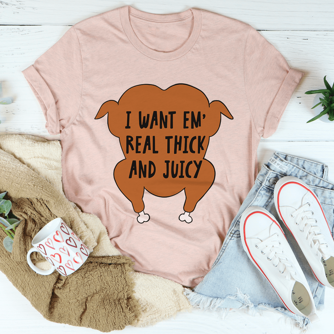 Light pink T-shirt featuring centered cartoon text graphic, crew neck, short sleeves