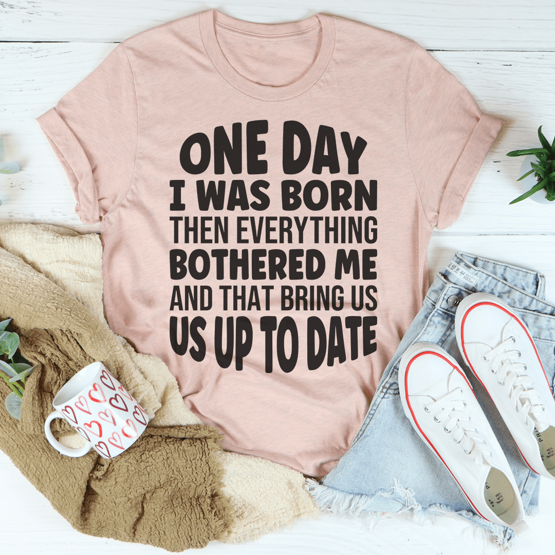 Peach T-shirt with bold black center quote graphic