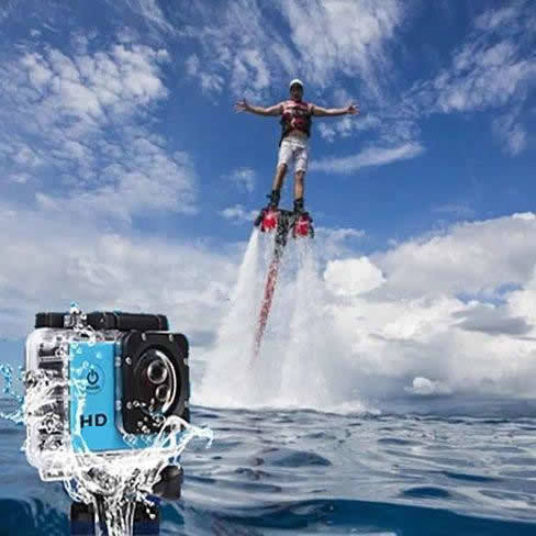 Underwater action camera in waterproof housing with water splash around