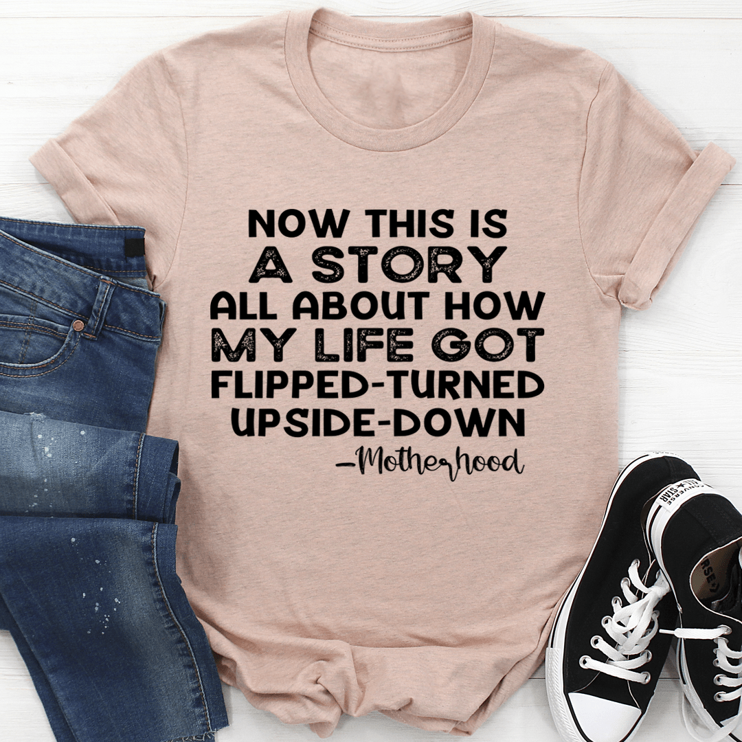 Beige motherhood T-shirt with 'Now this is a story' text graphic on front