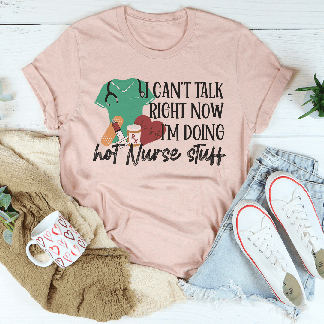 Peach nurse T-shirt with colorful 'I can't talk right now' graphic
