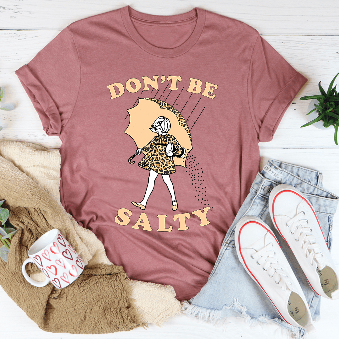 Mauve crewneck t-shirt with “Don’t Be Salty” girl-and-umbrella graphic