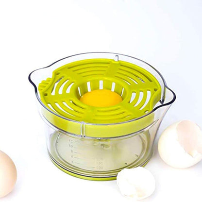 Green manual citrus squeezer with transparent bowl, cone juicer, and strainer top.