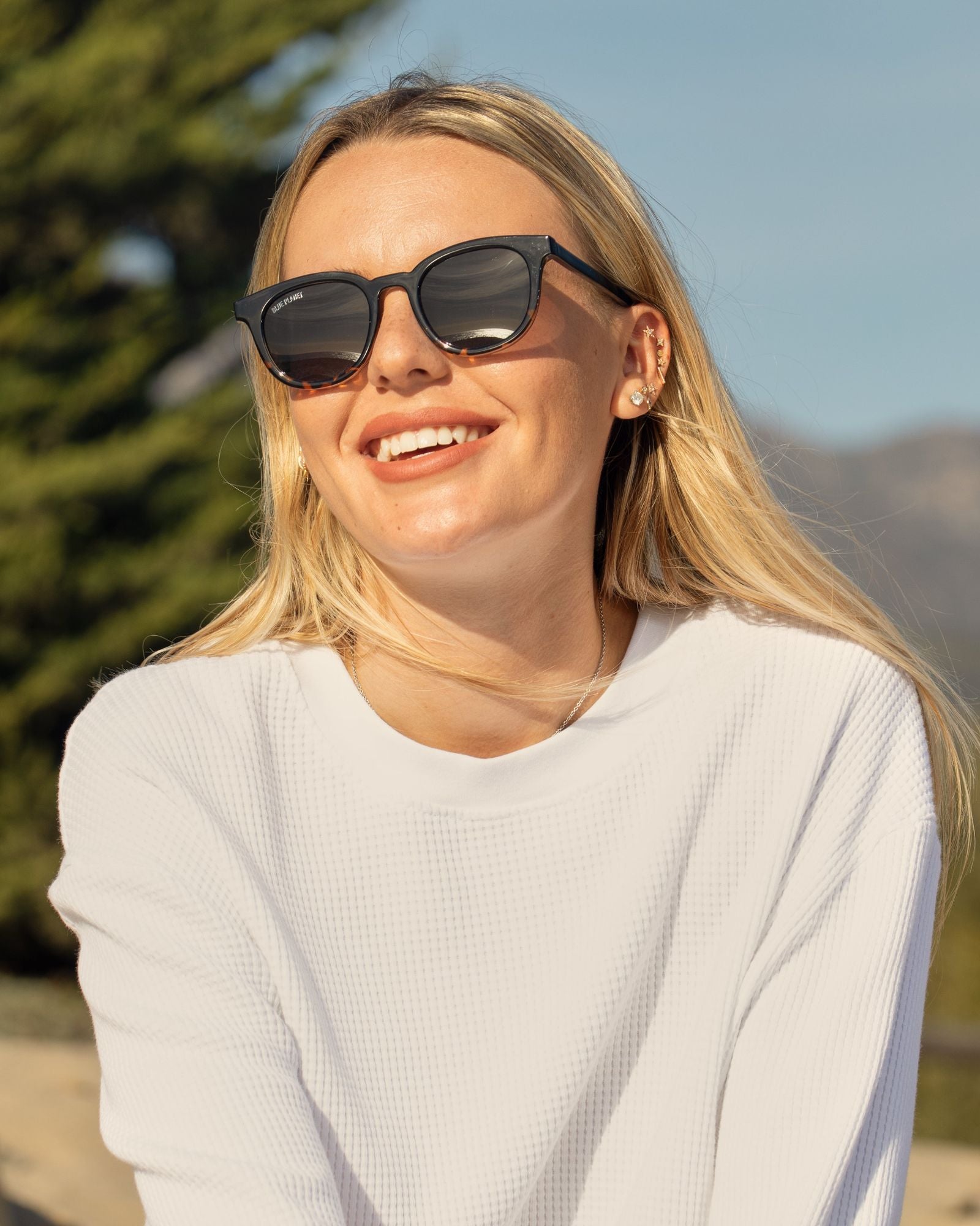 Black polarized sunglasses on a person, side view with brown tinted lenses