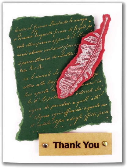 Stamped thank-you card with red feather design on green paper and a 'Thank You' tag.