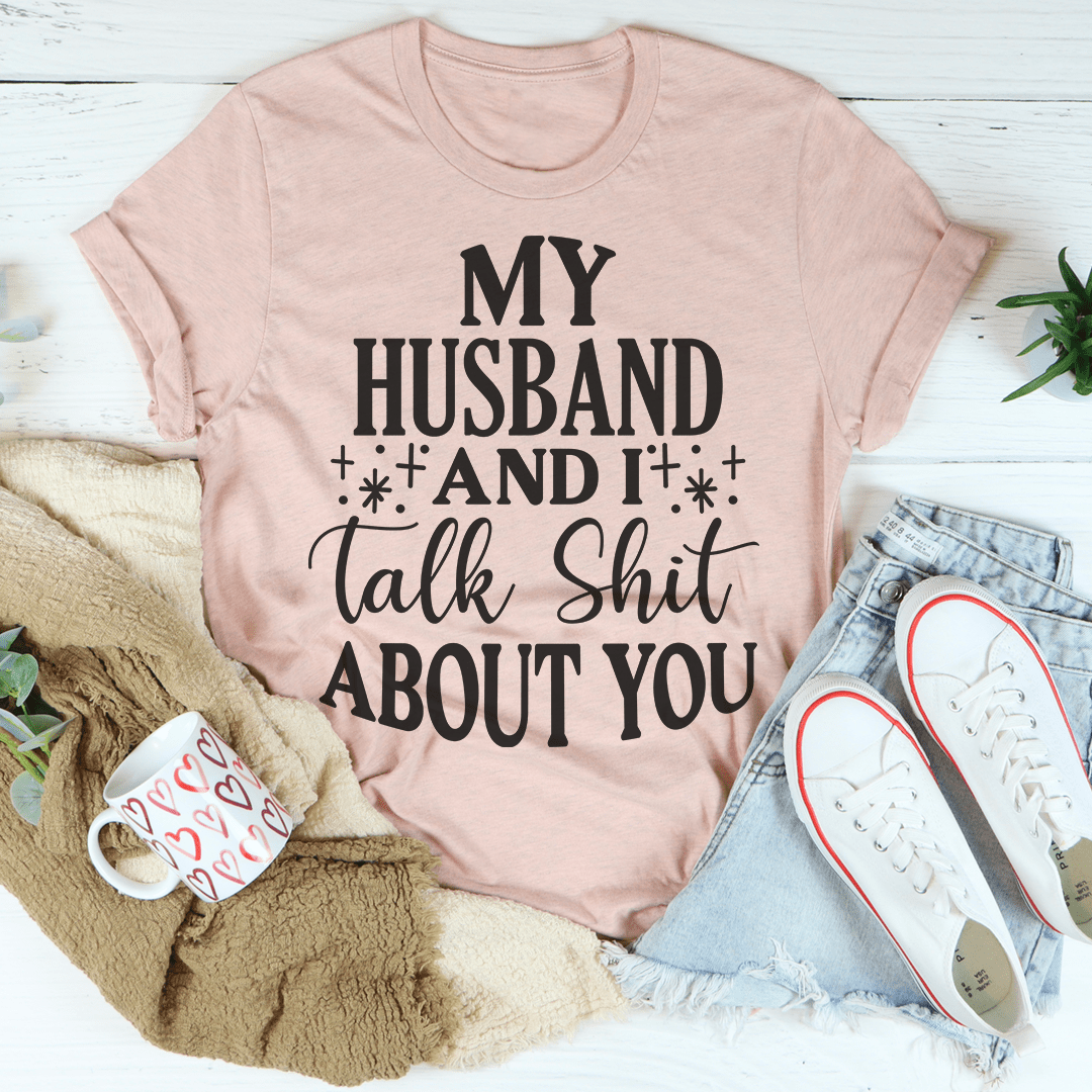 Light mauve crewneck T-shirt with bold "My Husband And It talk Shit About You" front graphic
