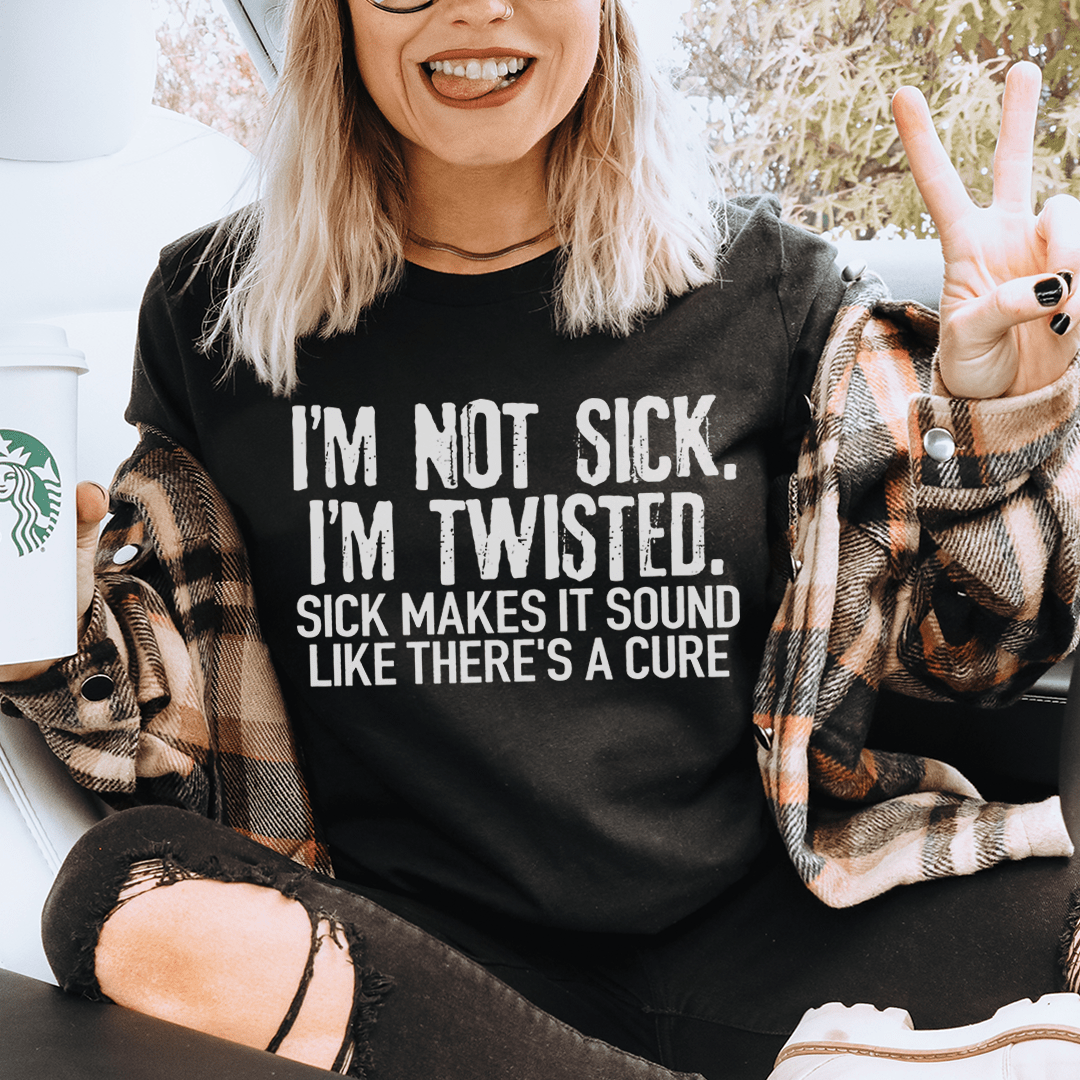 Black crew-neck graphic T-shirt with “I’M NOT SICK, I’M TWISTED” front text