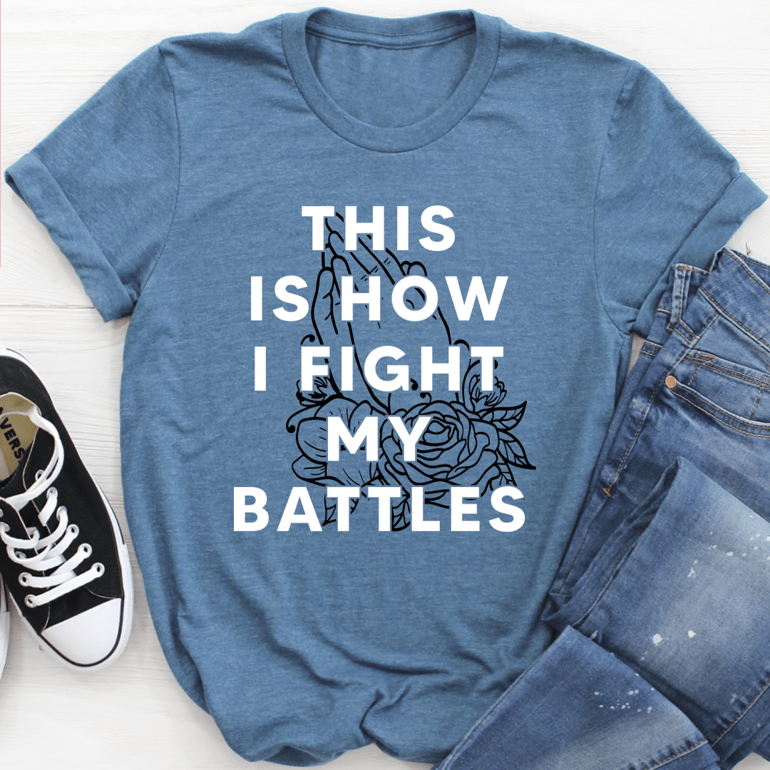 Steel blue graphic T-shirt with white slogan and rose print, crew neck, short sleeves.