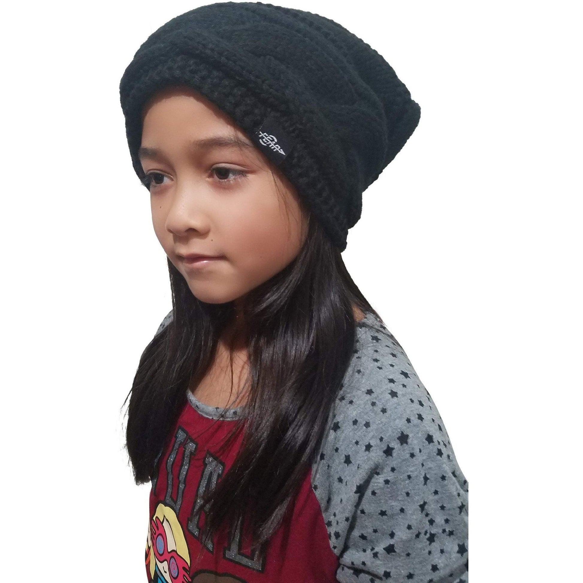 Black fleece-lined knit beanie hat on child, logo patch, ribbed knit