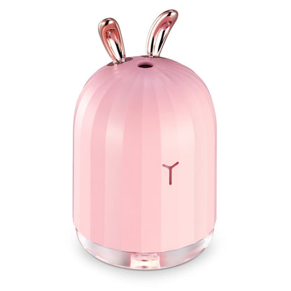 Pink bunny-shaped cool mist humidifier with rose-gold ears and clear base