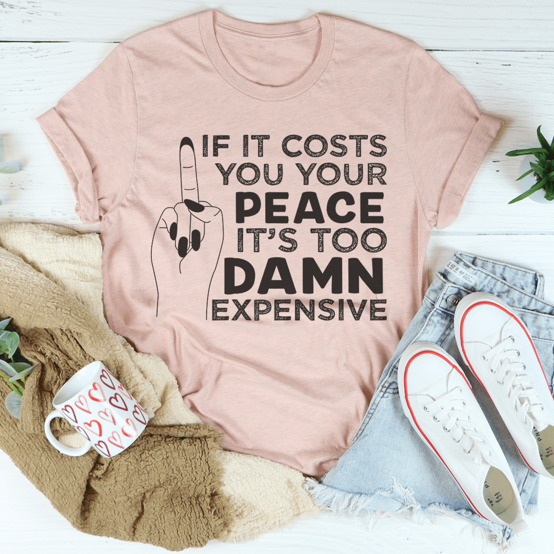 Light pink t-shirt with front graphic text and peace sign hand illustration