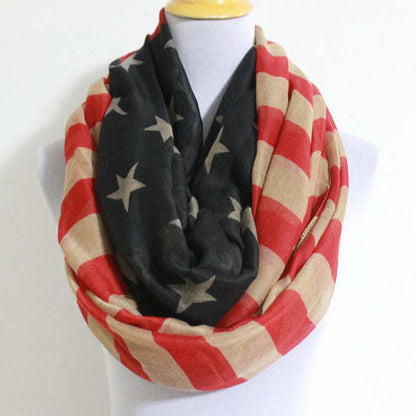 Infinity scarf close-up on mannequin: black stars with red-and-cream striped loop