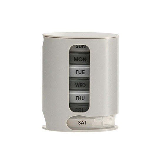 White 7-day pill organizer cylinder with day label window and base