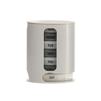 White 7-day pill organizer cylinder with day label window and base
