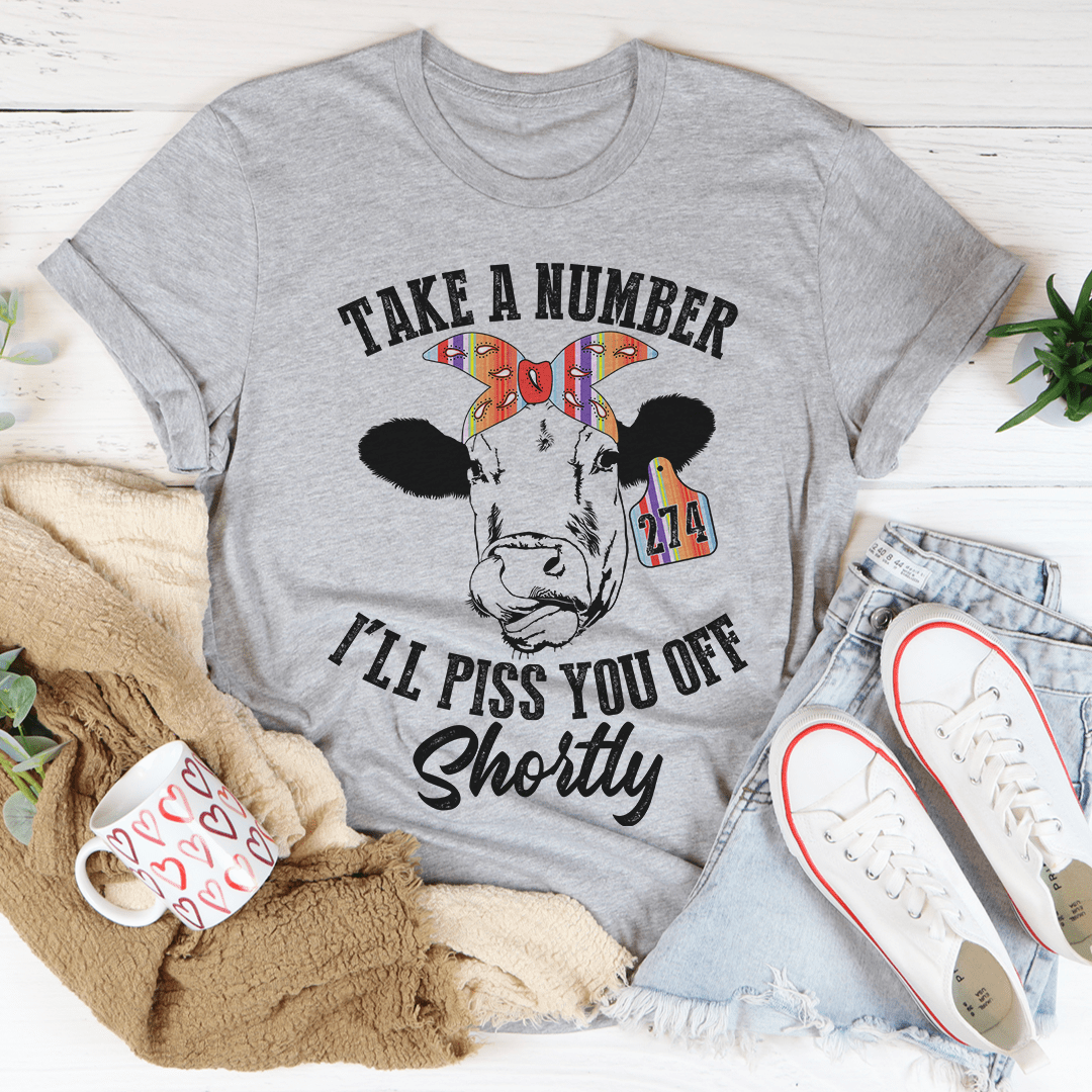 Heather gray T-shirt with centered cow graphic and “Take a Number” slogan
