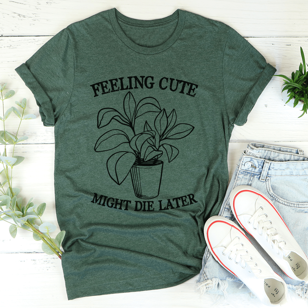 Green crewneck t-shirt with floral pot line art and "FEELING CUTE" quote