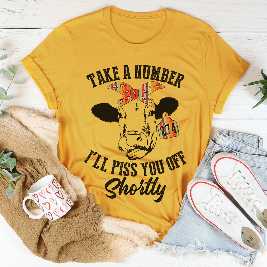Mustard cow T-shirt with slogan graphic and 'Shortly' script, crew neck, short sleeves