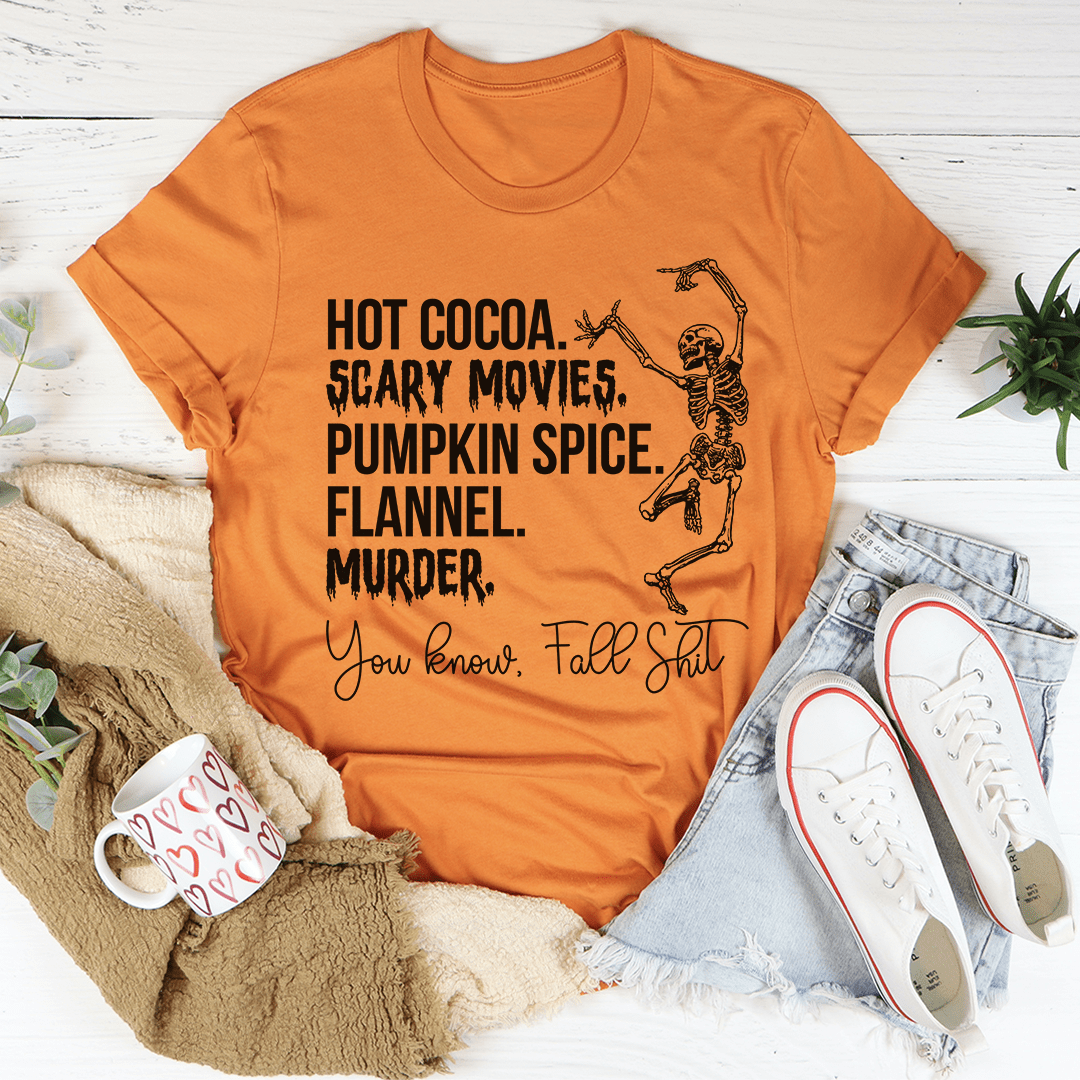 Burnt orange crewneck T-shirt with Halloween pumpkin text and skeleton graphic.