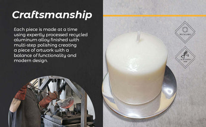 White pillar candle on round metal candle holder/coaster