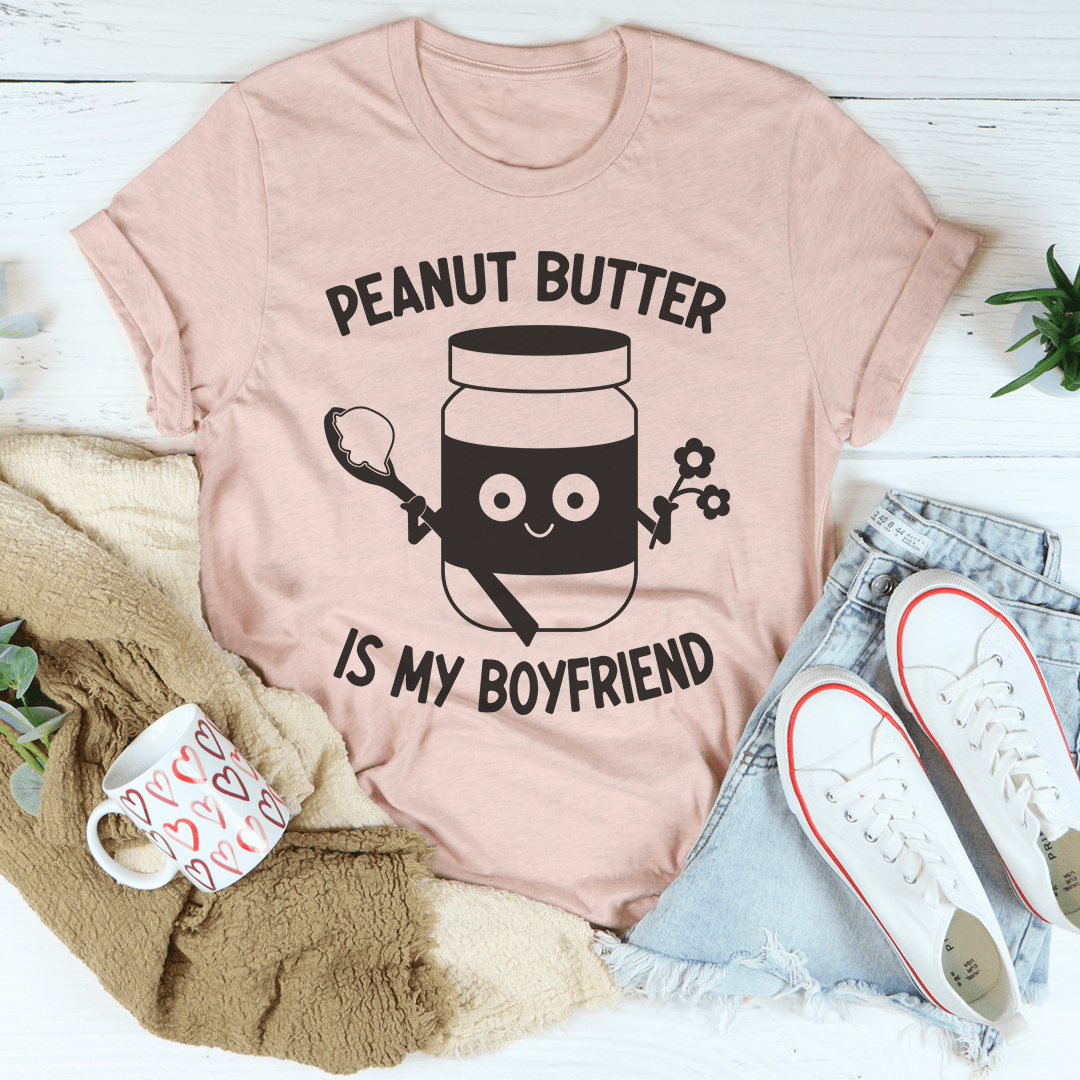 Light mauve unisex T-shirt with “PEANUT BUTTER IS MY BOYFRIEND” graphic front