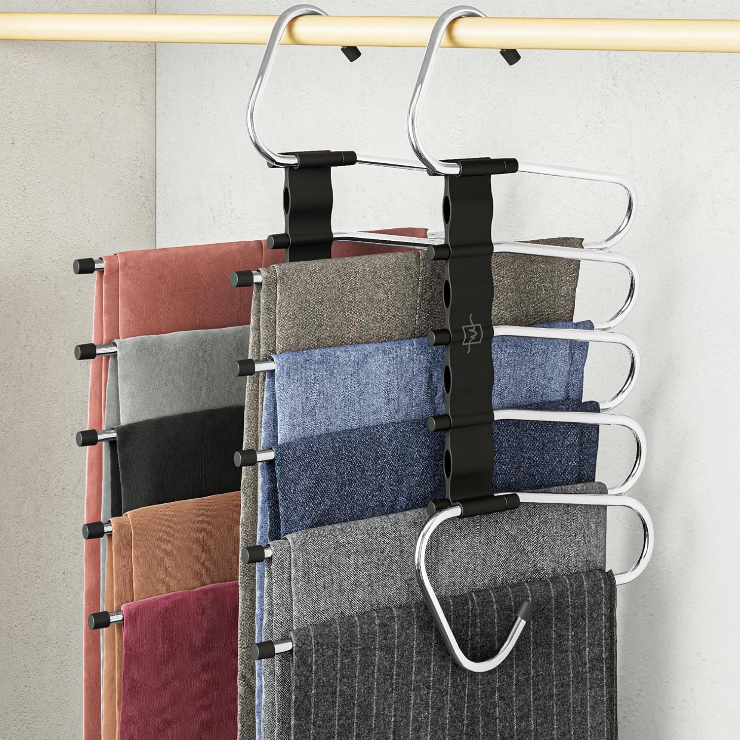 Non-slip multi-layer pants hanger set, black metal clips holding folded trousers