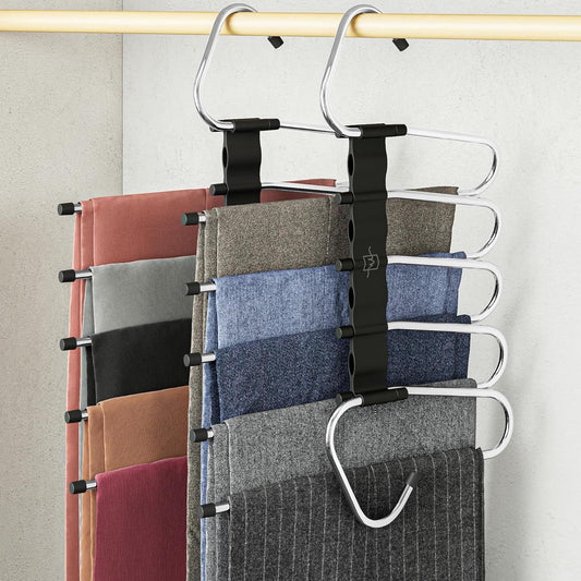 Non-slip multi-layer pants hanger set, black metal clips holding folded trousers