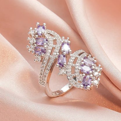 Amethyst zircon cocktail ring with oval purple stones and sparkling halo detail