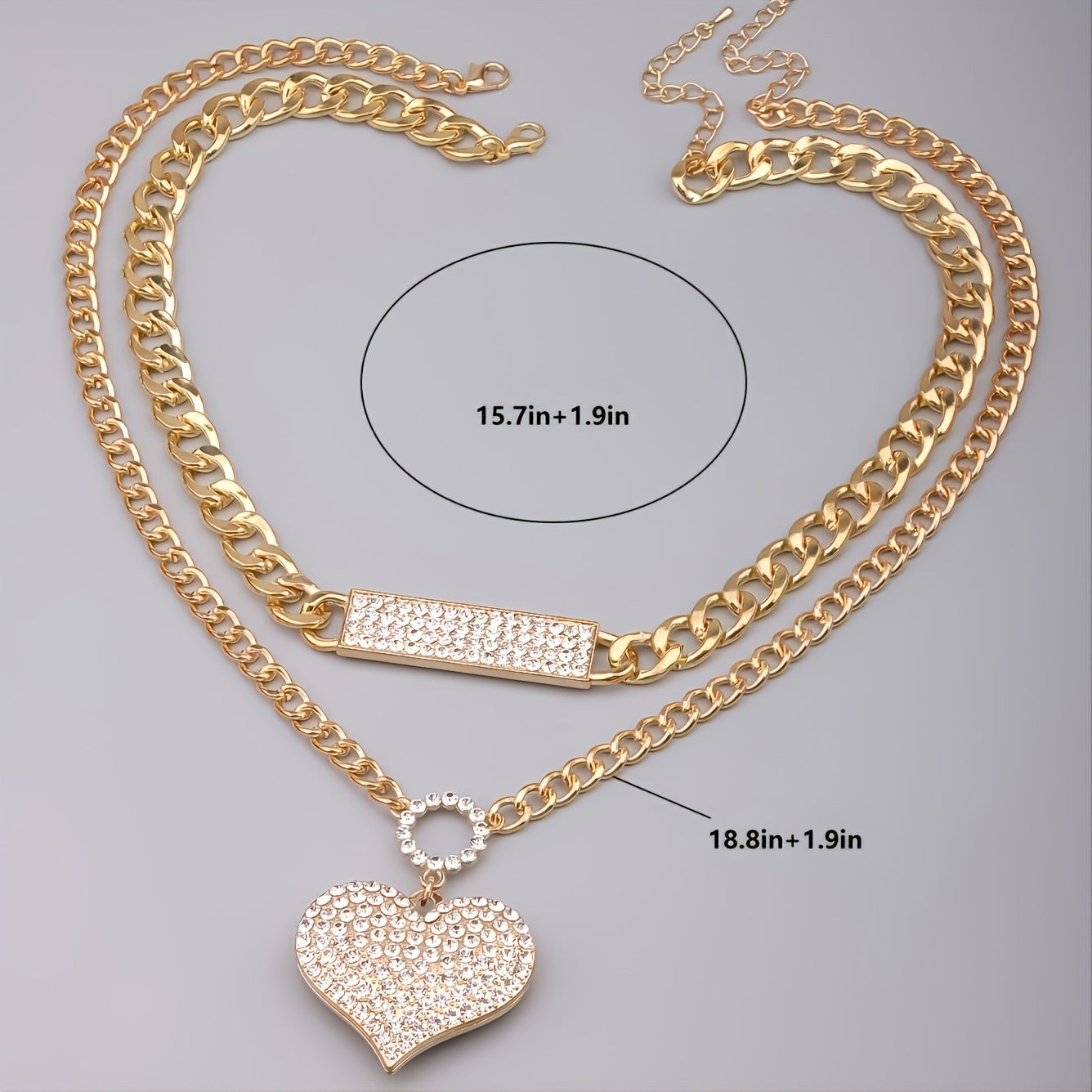 Gold double necklace set with crystal bar link and heart pendant on layered chains
