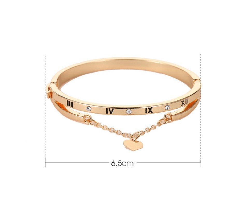 Rose gold-tone bangle bracelet with roman numerals, heart charm, 6.5cm width